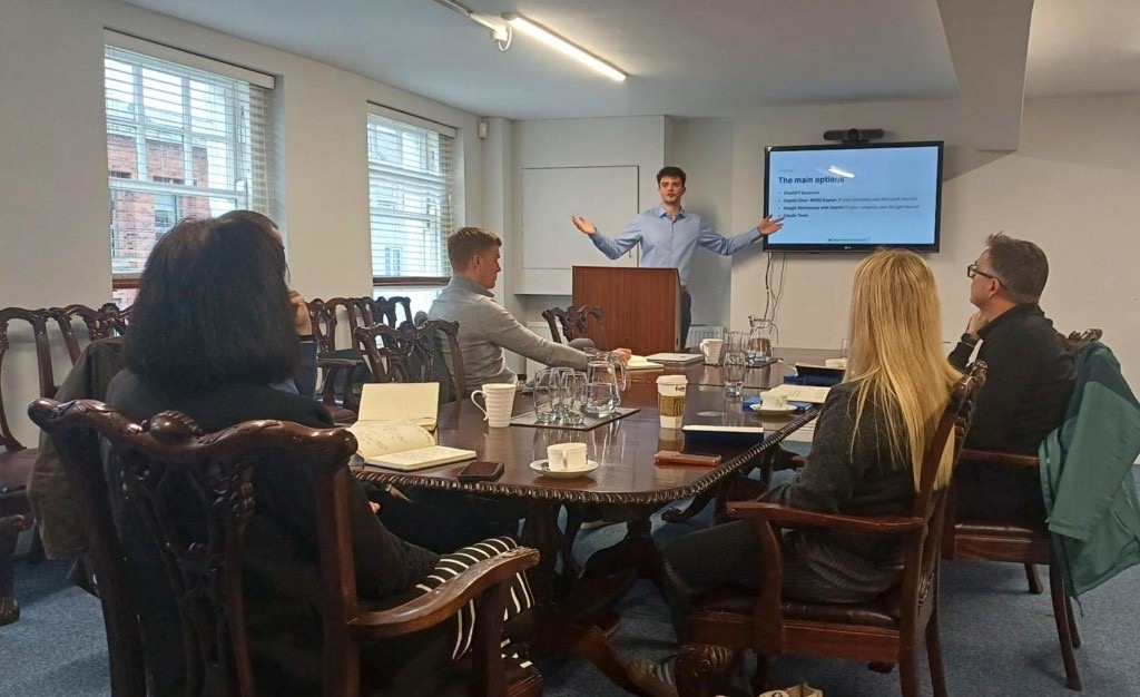 Liam Coyle delivering a Leadership AI Clarity Workshop to a leadership team around a boardroom table
